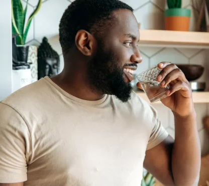 man drinking herbalife aloe concentrate