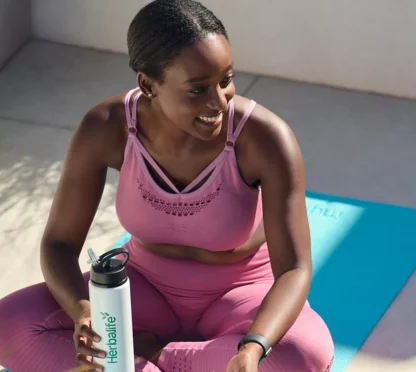 woman with herbalife protein drink mix powder