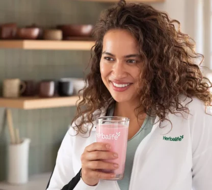 lady drinking herbalife formula 1 shake